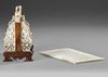 A CHINESE CARVED BONE PLAQUE ON STAND, LATE 19TH-EARLY 20TH CENTURY