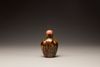 A celadon and russet jade snuff bottle