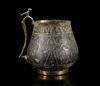 A VERY RARE AND IMPORTANT EARLY ISLAMIC PARCEL-GILT CUP