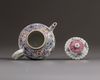 A small Chinese famille rose moulded teapot and cover