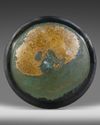 AN ACHAEMENID BRONZE LOTUS PHIALE, CIRCA 6TH-5TH CENTURY B.C.