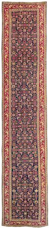 A LONG KARABAG RUNNER WITH HERATI DESIGN, 19TH CENTURY