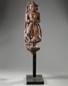 An Indian wood sculpture of a lady on a marble stand