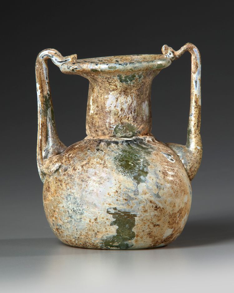 A ROMAN GLASS JAR WITH TWO HANDLES, CIRCA 3RD-4TH CENTURY AD