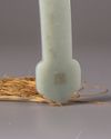 A Chinese hardstone-inlaid pale celadon jade ruyi sceptre