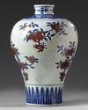 A Chinese underglaze copper red decorated blue and white meiping