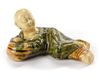 A CHINESE SANCAI CERAMIC BRUSH REST IN THE FORM OF A RECUMBENT BOY, SONG DYNASTY (960-1279)
