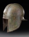A GREEK BRONZE ILLYRIAN HELMET, CIRCA 6TH-5TH CENTURY B.C.