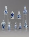 A group of nine miniature vases