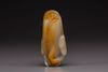 A white and russet jade magnolia carving