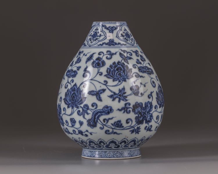A small blue and white vase