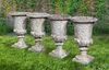 A SET OF FOUR WHITE COMPOSITION STONE GARDEN URNS IN THE ROMANTIC CLASSICAL MANNER, SECOND HALF 20TH CENTURY