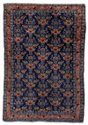 A FINE ANTIQUE PERSIAN SENNEH RUG