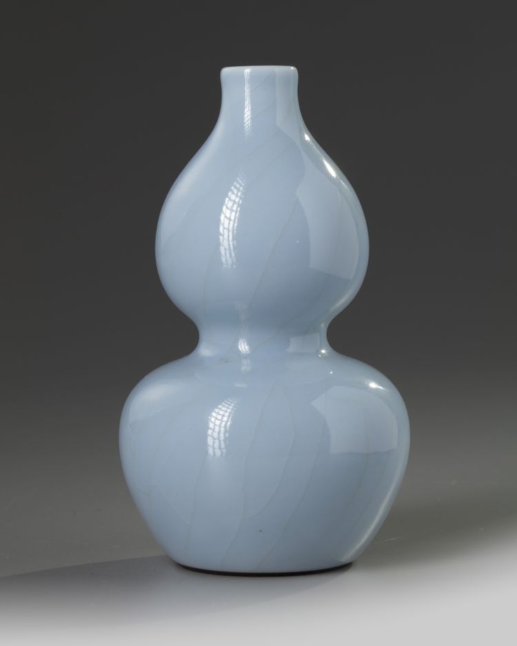 A small Chinese pale-blue crackle-glazed double gourd vase