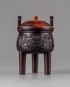 A CHINESE HARDWOOD ARCHAISTIC TRIPOD CENSER AND COVER, 19TH CENTURY