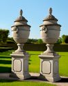 A PAIR OF LARGE AND IMPRESSIVE LIMESTONE CARVED GARDEN URNS ON PEDESTALS, LATE 20TH CENTURY