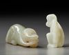 TWO CHINESE CELADON AND PALE CELADON JADE MONKEYS, 20TH CENTURY