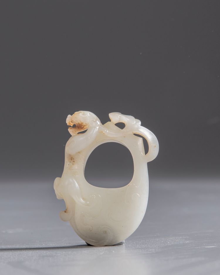 A white jade 'chilong' chicken heart pendant