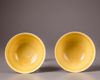 A pair of Chinese yellow-glazed ‘dragon’ bowls