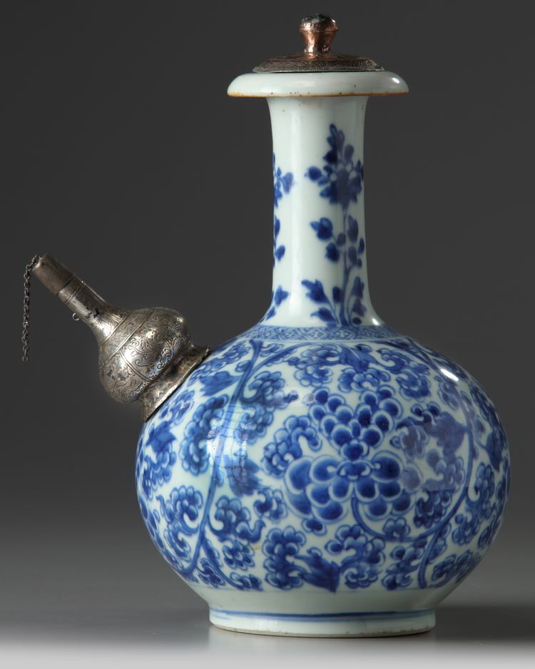 A SILVER-MOUNTED CHINESE BLUE AND WHITE 'FLOWER SCROLL' KENDI, KANGXI PERIOD (1662-1722)