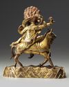 A Sino-Tibetan gilt bronze figure of Palden Lhamo