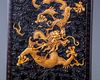 A Chinese carved and gilt zitan box and cover