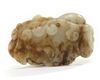 A Chinese pale celadon and russet jade 'boy and lingzhi' carving