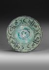 A KASHAN TURQUOISE AND BLACK POTTERY BOWL, PERSIA, 12TH-13TH CENTURY