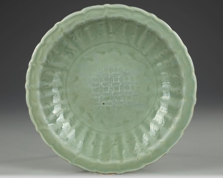 A CHINESE CELADON GLAZED DISH, POSSIBLY MING DYNASTY (1368-1644 AD)