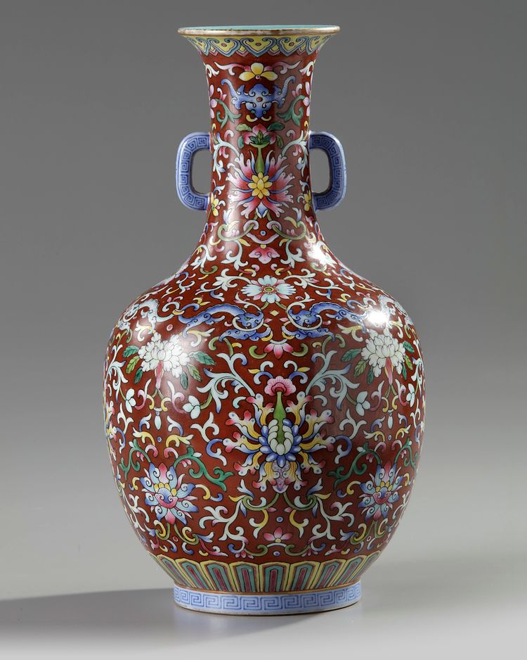 A Chinese red-ground famille rose bottle vase
