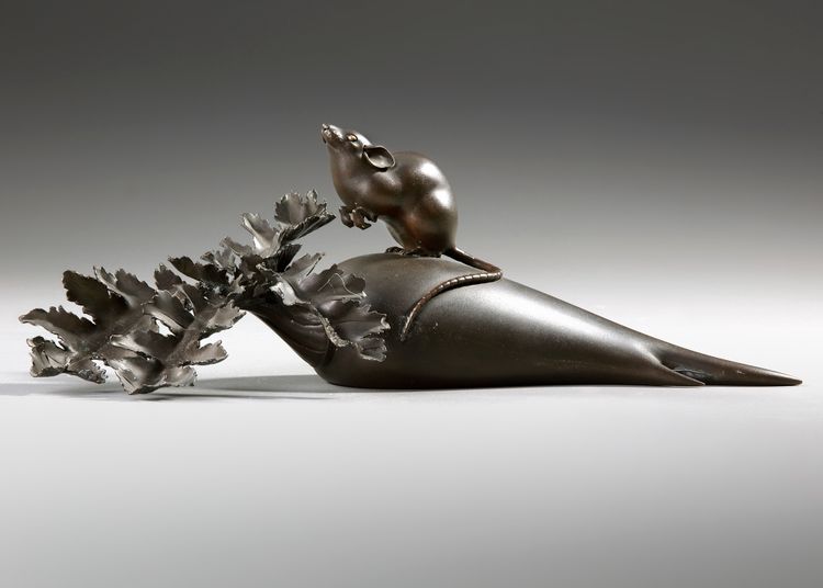 A DARK BRONZE OKIMONO SHOWING A LARGE MOUSE ON A DAIKON RADISH, EARLY 20TH CENTURY