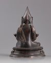 A CHINESE GILT BRONZE FIGURE OF LAMA