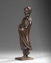 A CHINESE HARDWOOD CARVING OF LUOHAN HOLDING A SCROLL