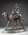 A BRONZE FIGURE OF A RIDER ON CAMEL, 19TH CENTURY