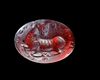 A SASSANIAN GARNET INTAGLIO WITH A RECLINING MOUNTAIN GOAT, 3RD-4TH CENTURY AD