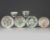 A group of Chinese iron-red-decorated and famille verte cups and saucers
