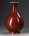 A CHINESE COPPER-RED-GLAZED PEAR-SHAPED VASE, YUHUCHUNPING, DAOGUANG SIX CHARACTER SEAL MARK IN UNDERGLAZE BLUE AND PROBABLY OF THE PERIOD (1821-1850)