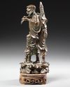 A CHINESE BRONZE FIGURE  OF LOHAN WITH A BOY, 19TH CENTURY