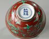 A Chinese red-ground green-enamelled 'dragon' bowl