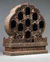 A Chinese hardwood parcel-gilt foliate altar cabinet