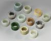 A group of twelve Chinese jade and agate archer rings