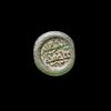 A FATIMID GLASS WEIGHT OF HALF DIRHAM, AL-HAKIM BI-AMR ALLAH (386AH-411AH/ 996AD-1021AD)
