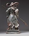 A large gilt and polychrome decorated bronze figure of Guandi