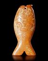 A REDDISH-YELLOW JADE "FISH" CARVING, CHINA, LIANGZHU CULTURE