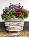 A CARVED LIMESTONE PLANTER, 20TH CENTURY