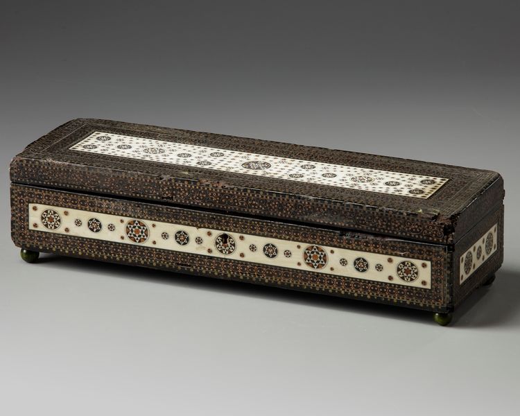 A silver and ivory inlaid wooden box