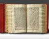 A SMALL RED LEATHER-BOUND QURAN