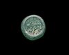 AN EARLY ISLAMIC GLASS WEIGHT OF HALF DIRHAM