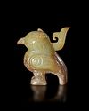 A GREENISH-YELLOW JADE CARVING OF A BIRD, CHINA, SHANG DYNASTY