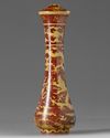 A CHINESE IRON-RED AND YELLOW-ENAMELLED 'DRAGON' BRUSH HANDLE, QING DYNASTY (1644-1911)